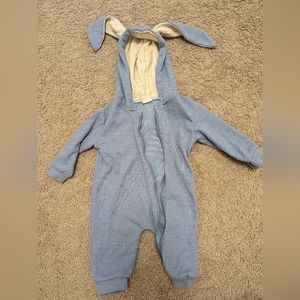 Baby one piece with a hood.